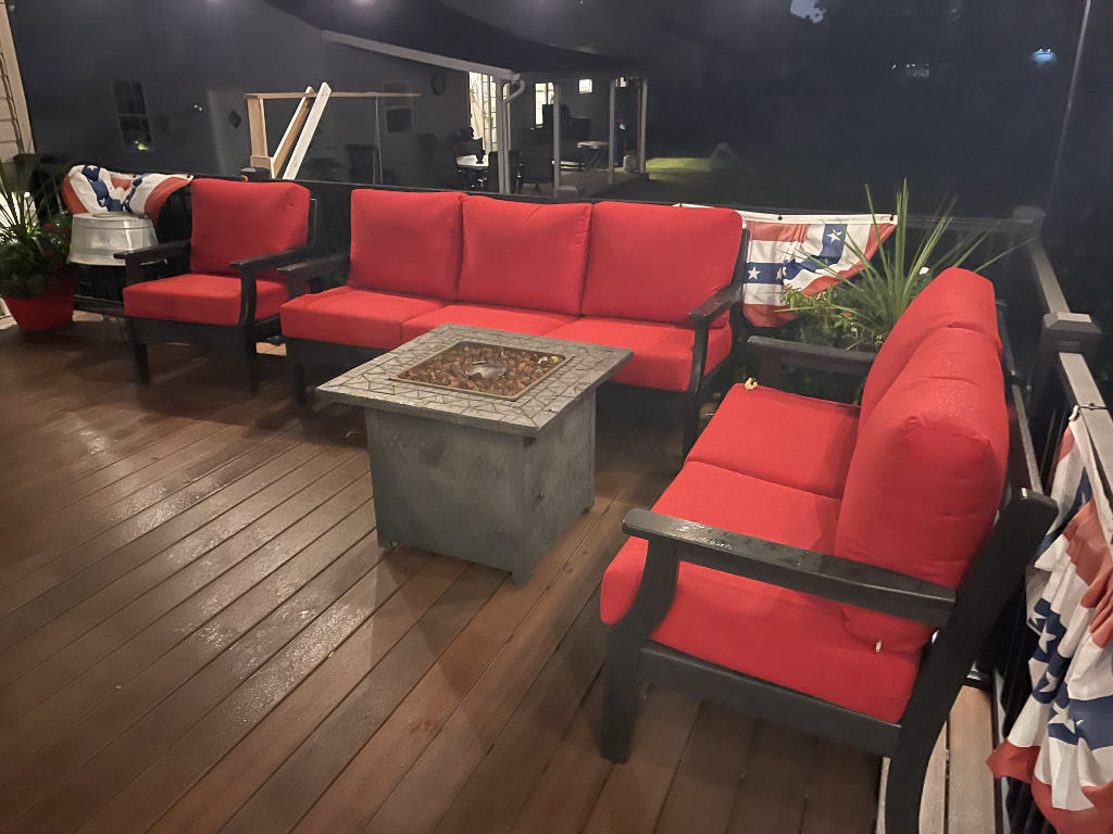 Deep seating couch, love seat, and chair around a fire pit.