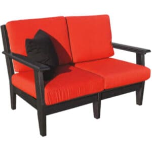 Dunes Deep Seating Loveseat with red cushions.
