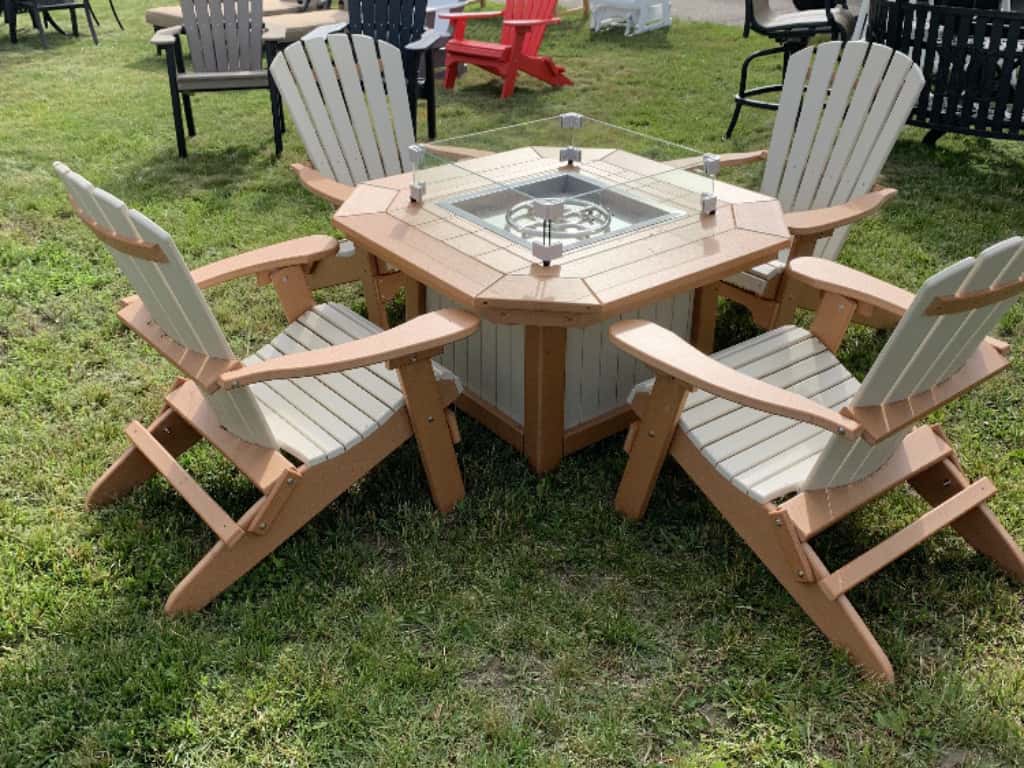 Fire pit with four folding Adirondack chairs.
